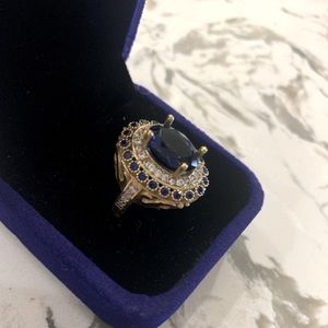 Beautiful lab sapphire with accent moissanite gemstones.